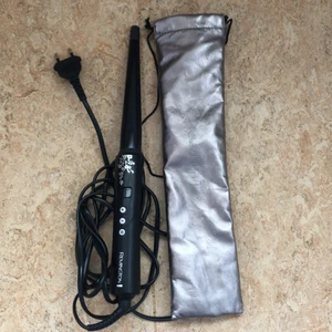 Remington locktång  - Remington locktång med påse. Fungerar galant. Inga fel. 