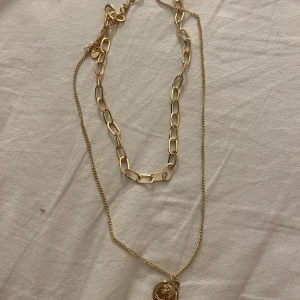Guld halsband  - 2 i ett halsband, superfint, aldrig använd. 50kr