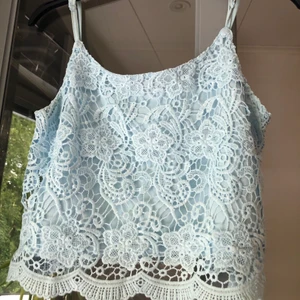 Linne - Blått linne med broderi. Storlek S-M💙