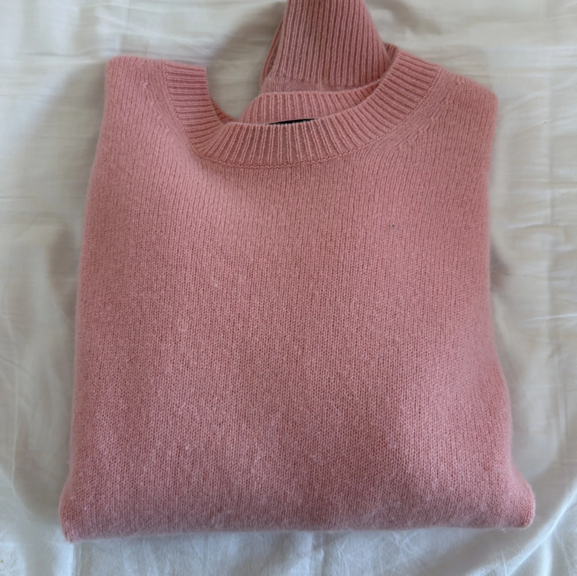 Rosa stickad tröja från Uniqlo