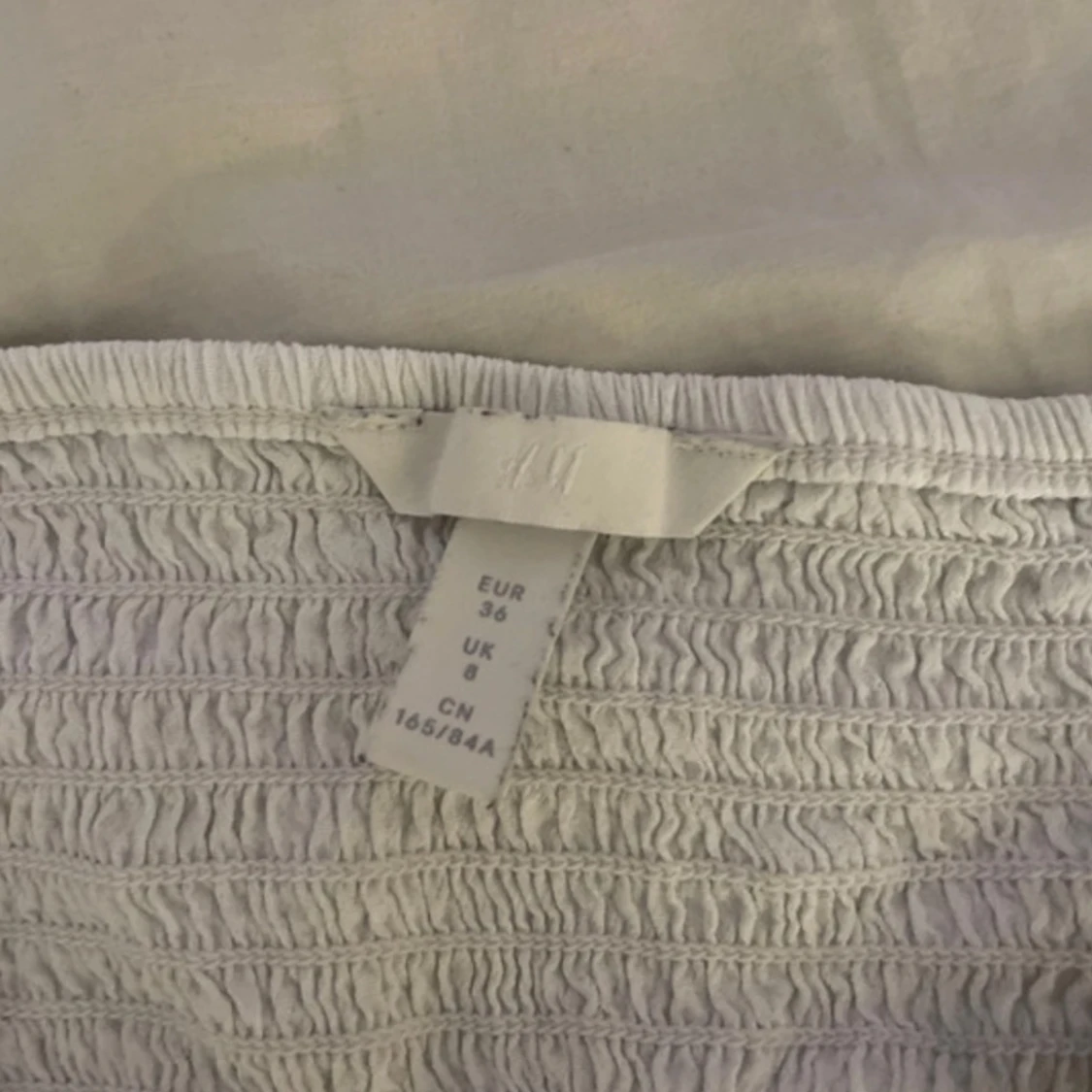 Vitt linne med knappar - 91