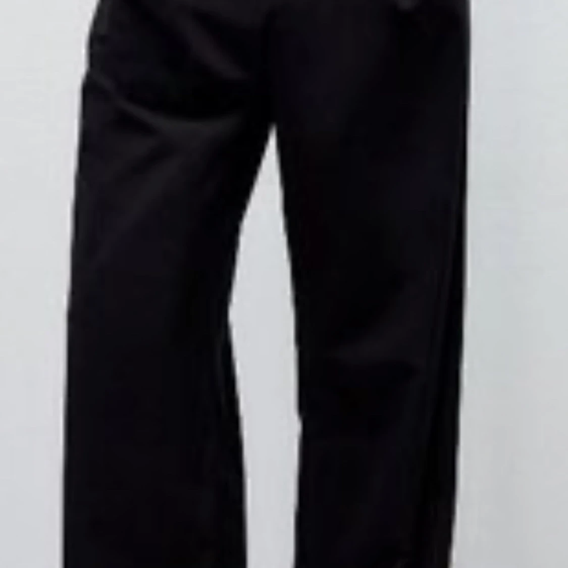 Svarta vida byxor strl M Nya