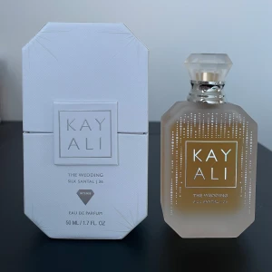 Kayali The Wedding Silk Santal 36 - Kayali Wedding Silk Santal 36 eau de parfum in 50 ml. Few sprays used. It is sweet, vanilla, feminine fragrance. Notes are sparkling champagne, freesia, pink praline, nectarine, sandalwood, sugared musk. Limited edition. 