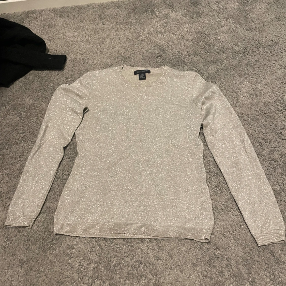 Glittrig beige tröja