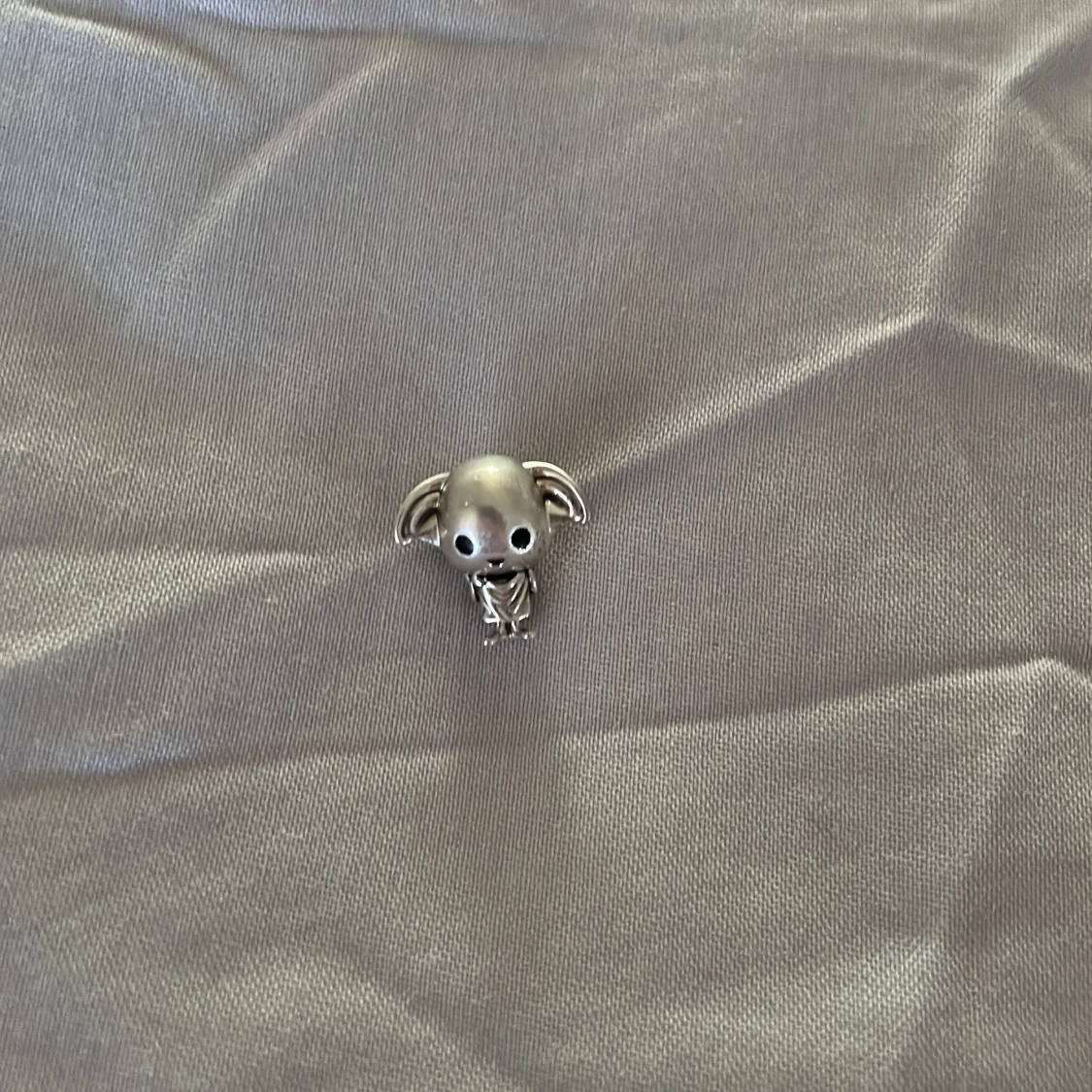 Silverfärgad berlock