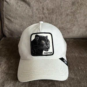 The farms keps - The FARMS vit keps med en panther