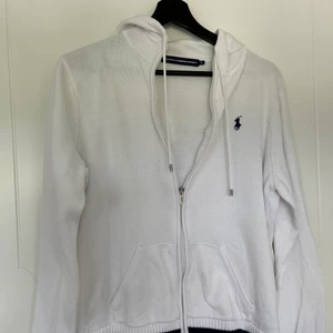 Ralph Lauren zip up hoodie  - White zip up hoodie! very warm as well. Has two little stains on it but you should be able to remove it with a stain remover 