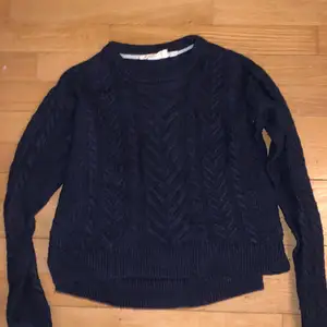 Older but good quality, navy blue knitted sweater