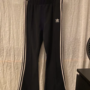 Adidas flared pants  - Black track suit adidas flared pants. Size M Highwaisted 