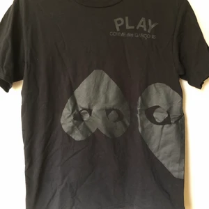 CDG / Comme Des Garçons Black Heart Tee - CDG Play / Comme Des Garçons Black Heart T-Shirt  Size small, fits like a regular size small.  Excellent condition, no flaws or damage.  DM if you need exact size measurements.   Buyer pays for all shipping costs. All items sent with tracking number.   No swaps, no trades, no offers. 