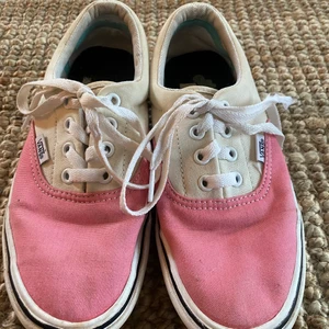 Colorful Vans  - colorful vans, one shoelaces is missing the tip of it. 