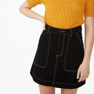 black denim skirt with yellow contrast stitching from monki, worn once. super cool and has pockets!!!!!! 