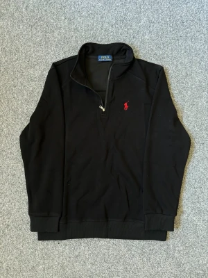 Ralph Lauren black quarter zip sweater - Size M, true to size. Very comfortable and fits perfectly.