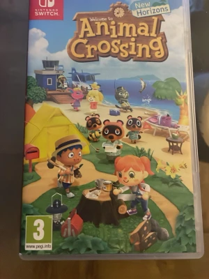Animal Crossing: New Horizons Switch - Animal Crossing: New Horizons till Nintendo Switch. Spelet har ett färgglatt omslag med karaktärer på en ö och levereras i originalfodral med spelkassett. Perfekt för dig som gillar avslappnade och kreativa spel i tecknad stil.