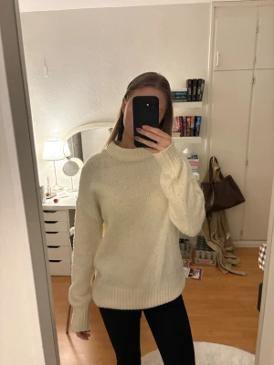 Lager 157 Cream Knitted Sweater - A classic, cozy staple for your wardrobe! This chunky knit sweater from Lager 157 is perfect for that clean girl or Scandinavian aesthetic.      Color: Cream / Off-white / Ivory  Style: Features a mock neck (high collar), ribbed cuffs and hem, and a relaxed, slightly oversized fit. Condition: Good pre-owned condition. It’s a thick, warm material that feels very high-quality and soft against the skin.