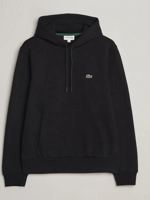 Svart hoodie från Lacoste - Säljer en svart hoodie från Lacoste med klassisk huva och dragsko. På bröstet sitter den ikoniska gröna krokodilloggan. Fler bilder skickas privat jätte bra skick