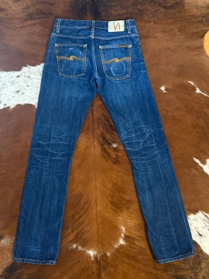 Nudie GrimTim DrySelvage - Tjena! Säljer dessa riktigt snygga nudie GrimTim DrySelvage, fin wash med nice fades, W30/L34, hör av dig vid funderingar!🙌