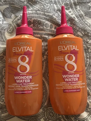 L'Oréal Elvital Wonder Water 2-pack - Två orange flaskor L'Oréal Paris Elvital Dream Length 8 Second Wonder Water, lamellbehandling för långt och skadat hår. 