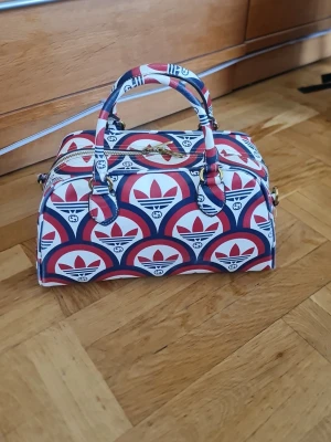 Adidas Canvass Bag  - Addidas canvas bag with defect on the side. Duffle bag. Nice bag for the summer. Pls check defect on the side.
