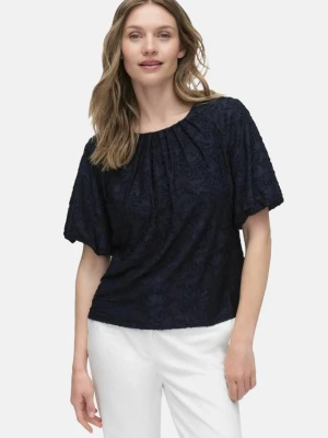 Mörkblå blus med strukturmönster - Snygg mörkblå blus med korta ärmar och blommigt mönster☺️ från Stockh LM💕 orginalpris 400kr💕 storlek XS men passar XS-M ungefär. Använd bara ett fåtal gånger💕