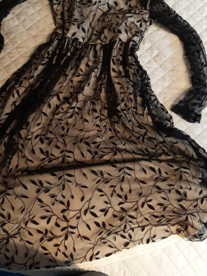 Beautiful dress for EUR 152 cm  - Beautiful long dress with beige base and black net details. Worn once only. Size says 152 cm  which is women size XXS or 11-12 years old. In excellent condition.