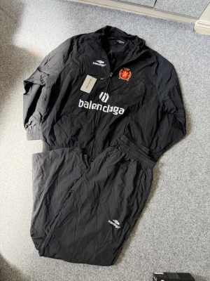 Balencaiaga black windbreaker set - Size M, true to size. Just like new. Unused, please feel free to ask questions if needed.