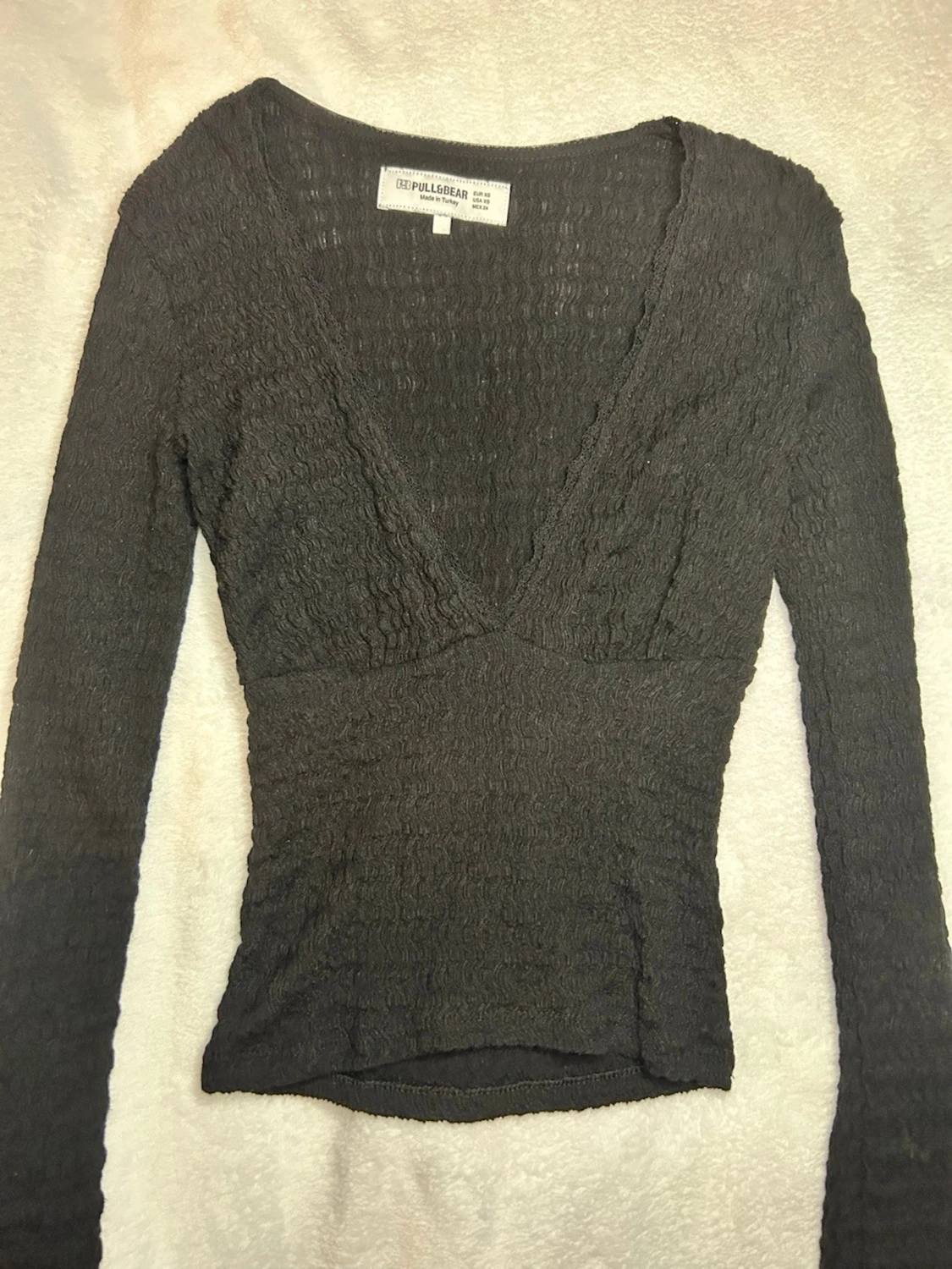 Svart v-ringad topp från Pull&Bear