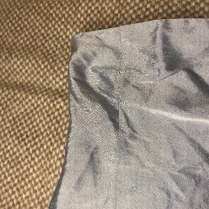 Topp  - Ljusblå/silver korsett topp!