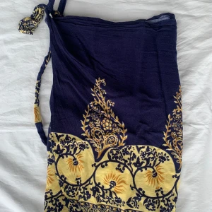 Strandkjol - En omlottkjol perfekt för en stranddag. Storlek S/M🩷