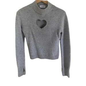 Cloeys tröja - 100% Merino Wool Grå tröja med hål för tummarna. Använt sparsamt och är varm.