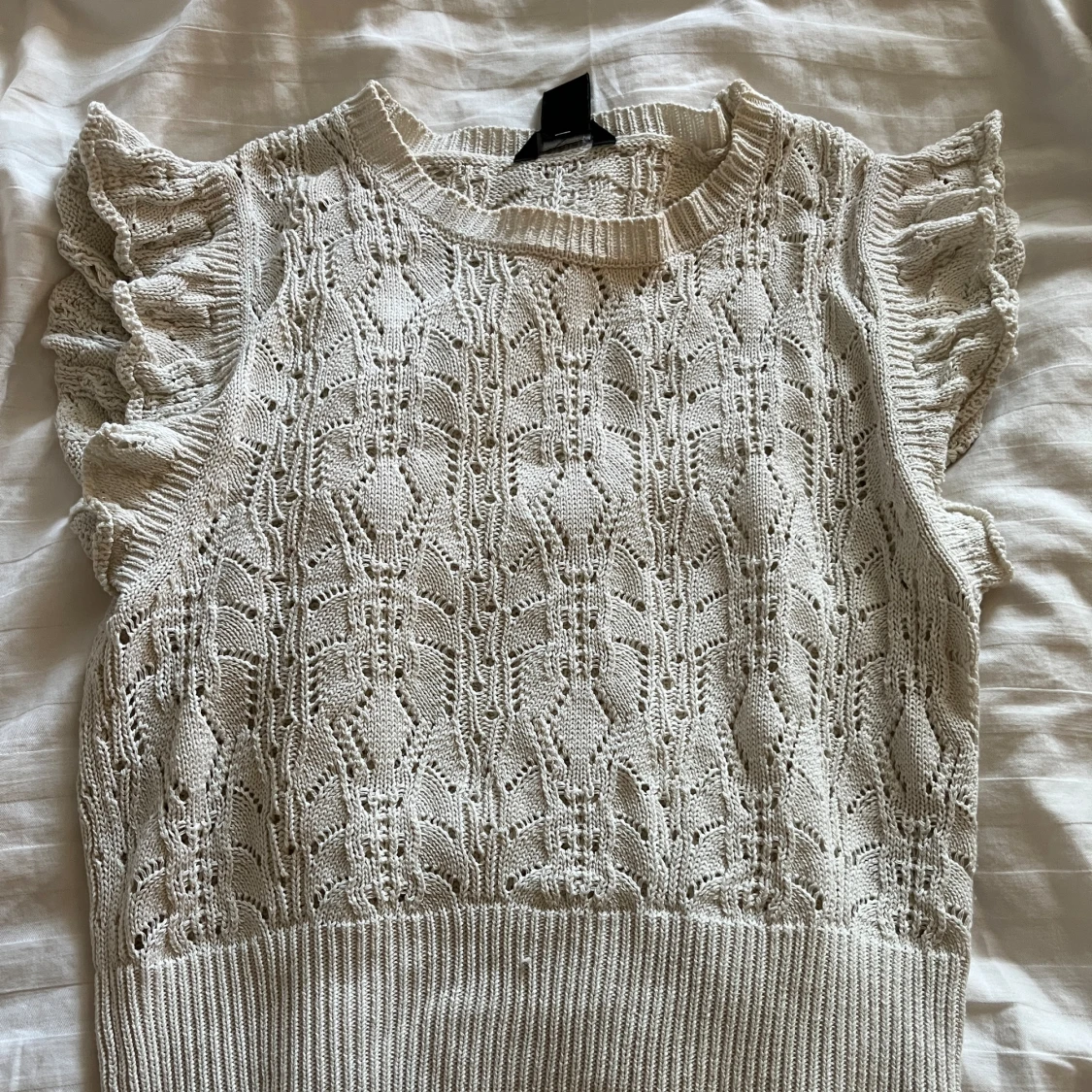 Stickad ärmlös topp