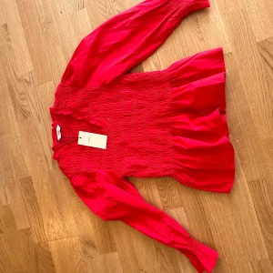 Smock Top - New and in perfect condition with the lable on it Size s Brand Only