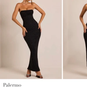 Balklänning!!Svart glittrig axelbandslös klänning från oh polly - Elegant svart axelbandslös klänning från Palermo med glittrande detaljer. Klänningen har en tight passform och en slits baktill för extra rörelsefrihet. Perfekt för en glamorös kväll.