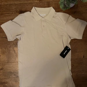 Take off polo shirt - 🏷️ Brand: Take off 📐 Size: S 🎨 Color: Beige 🧵 Material: 100% Cotton 👕 Fit: Regular 📏 Length: Regular ⭐ Condition: New with tags ⚠️ Defects: None