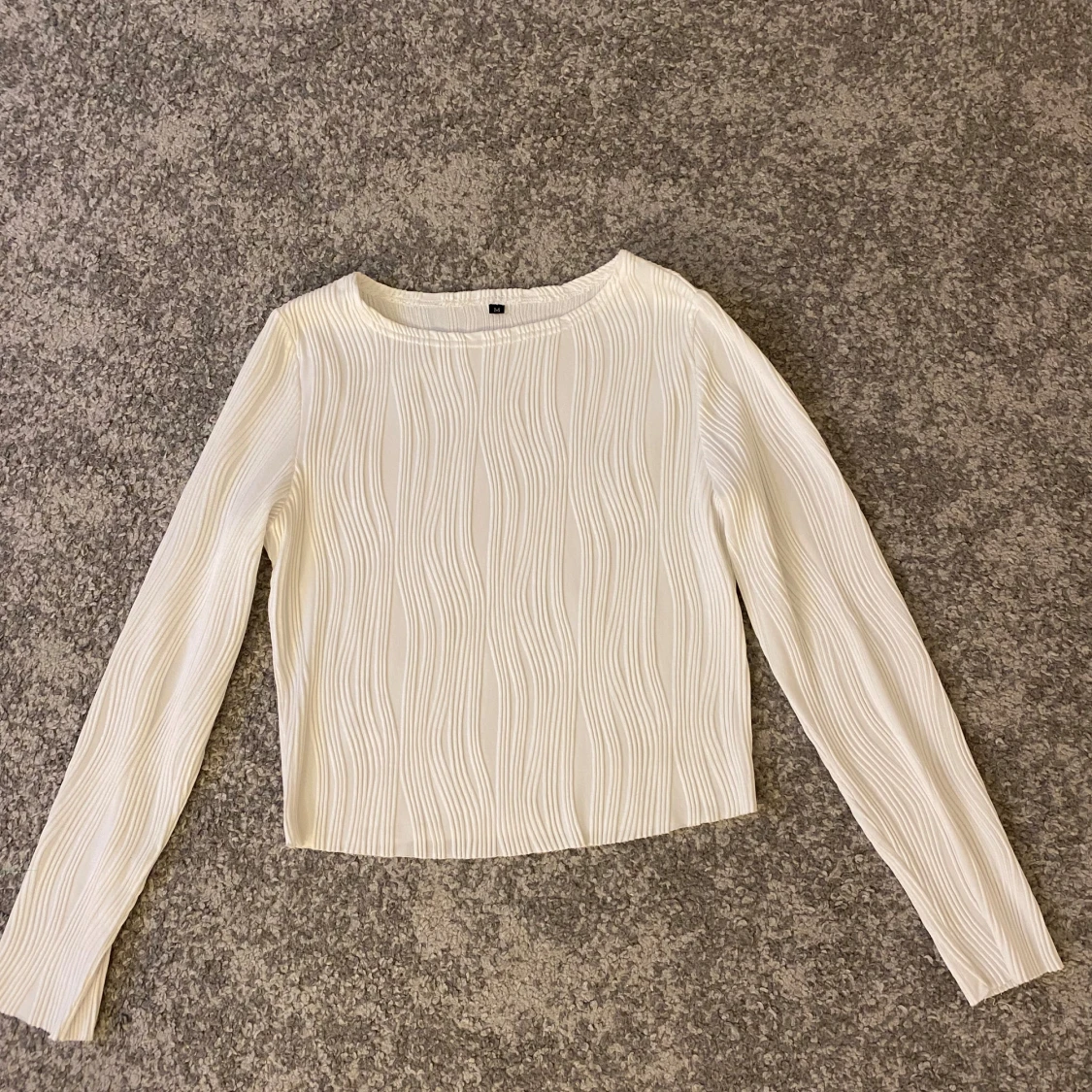 Vit långärmad topp med textur