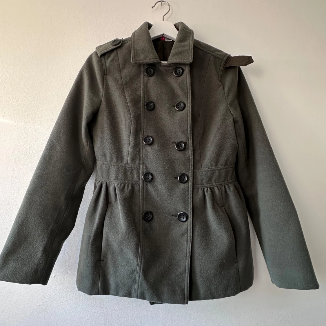 Grön kappa från Divided