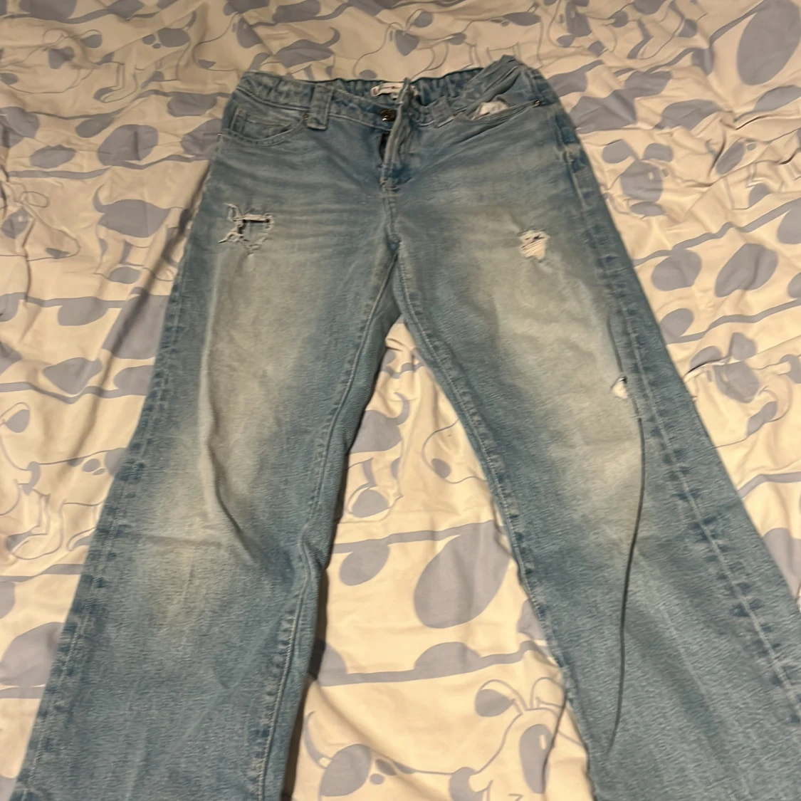 Ljusblå slitna jeans från Tommy Hilfiger