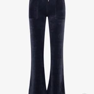 Svarta utsvängda byxor i sammet - Säljer mina blå Juicy Couture.