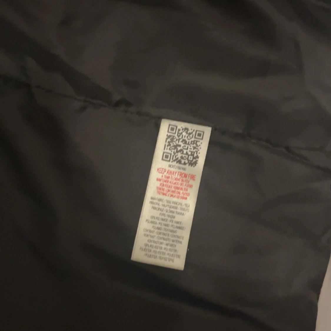 Svart och grå dunväst med huva från McKenzie - 1