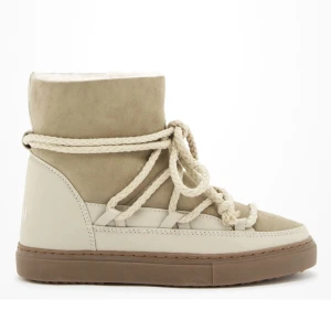 Inuikki vinterskor - Säljer mina beiga inuikki vinterskor pga att de inte kommer till användning, de är i fint skick och inte använda supermycket