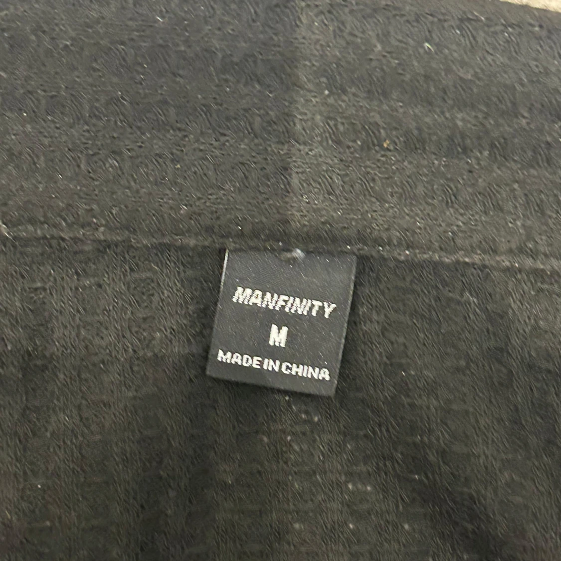 Svart pikétröja från Manfinity M - 1