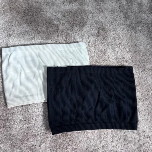 Tank tops - Säljer två ribbade tank tops från Pull&Bear. Aldrig använda. Funkar också att ha som kjol. Går att köpa separat också, hör av dig!! 30 kronor för båda 
