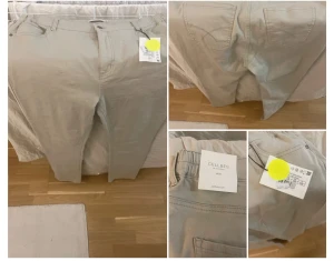 Beige raka byxor från Cellbes - Snygga beige byxor från Cellbes med klassisk rak passform. De har fickor både fram och bak, bälteshällor och diskreta sömmar. Materialet är mjukt och känns bekvämt mot huden, perfekt för dig som gillar stilrena och enkla plagg.