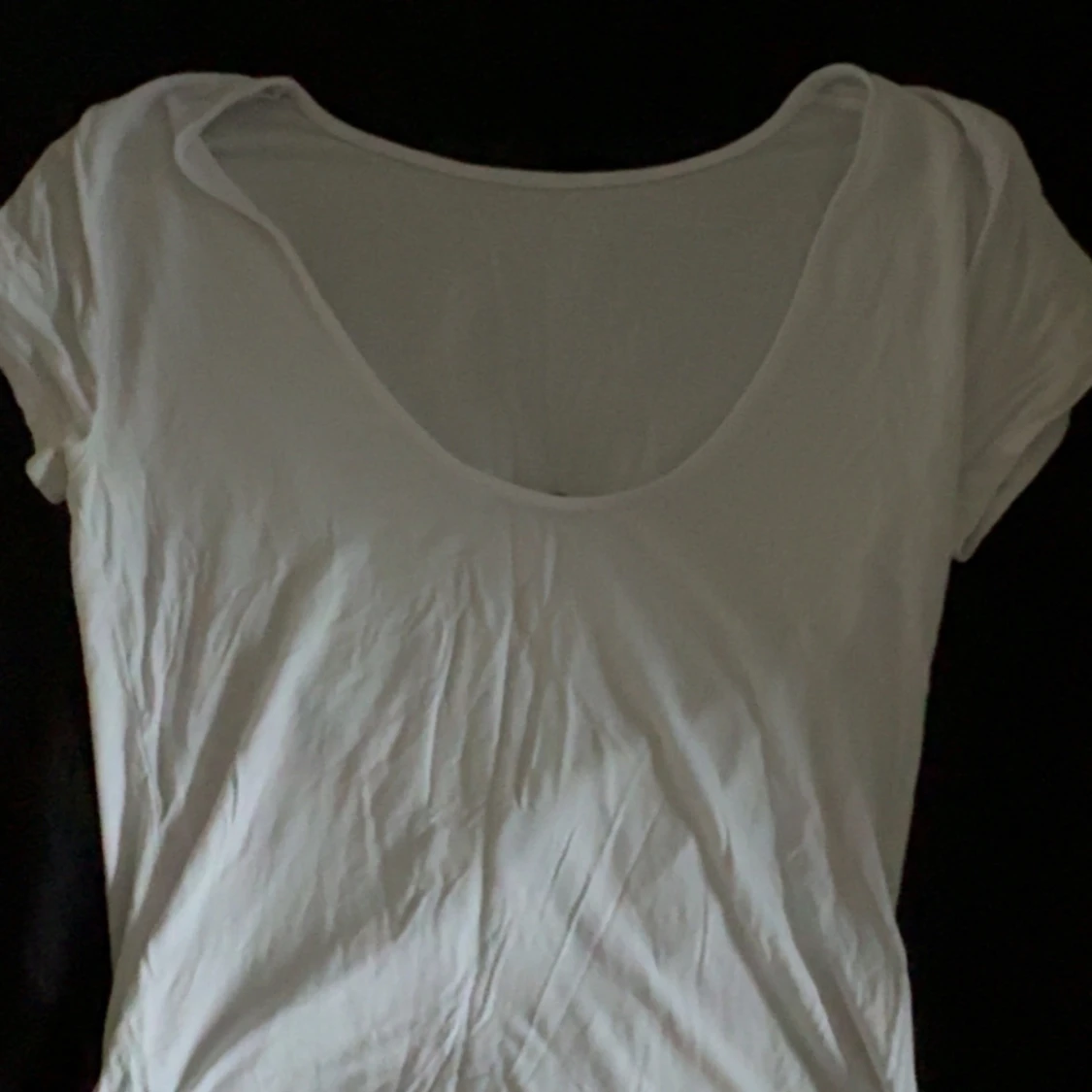 Vit kortärmad linnetopp