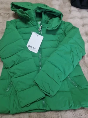 Grön pufferjacka dam - Dan size 