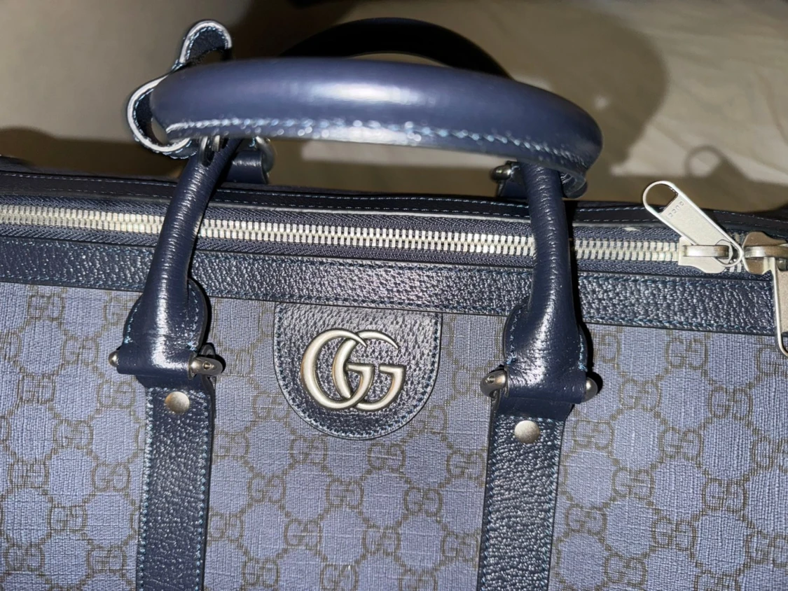 Gucci blå resväska med GG-mönster