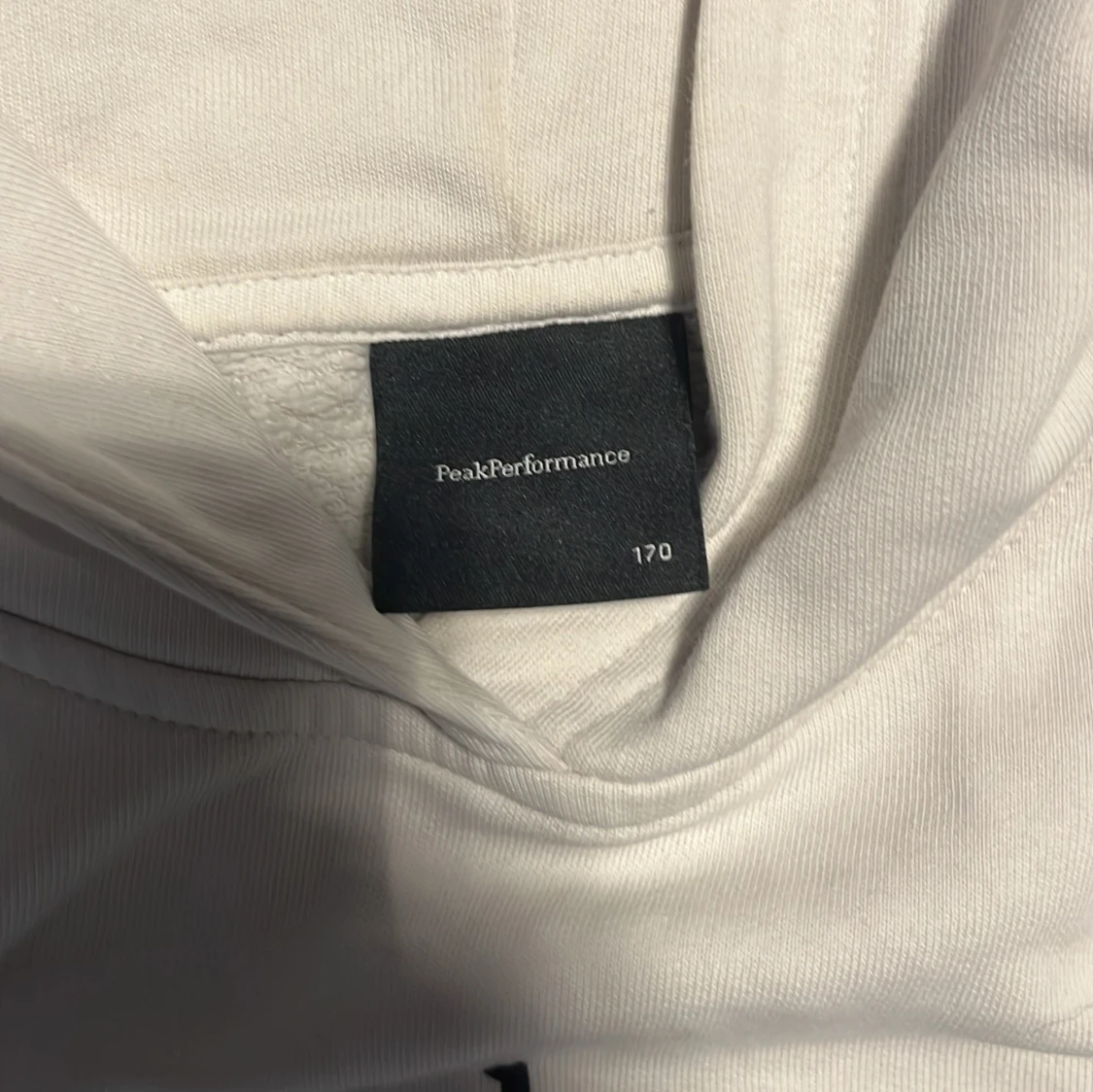 Vit hoodie från Peak Performance - 1