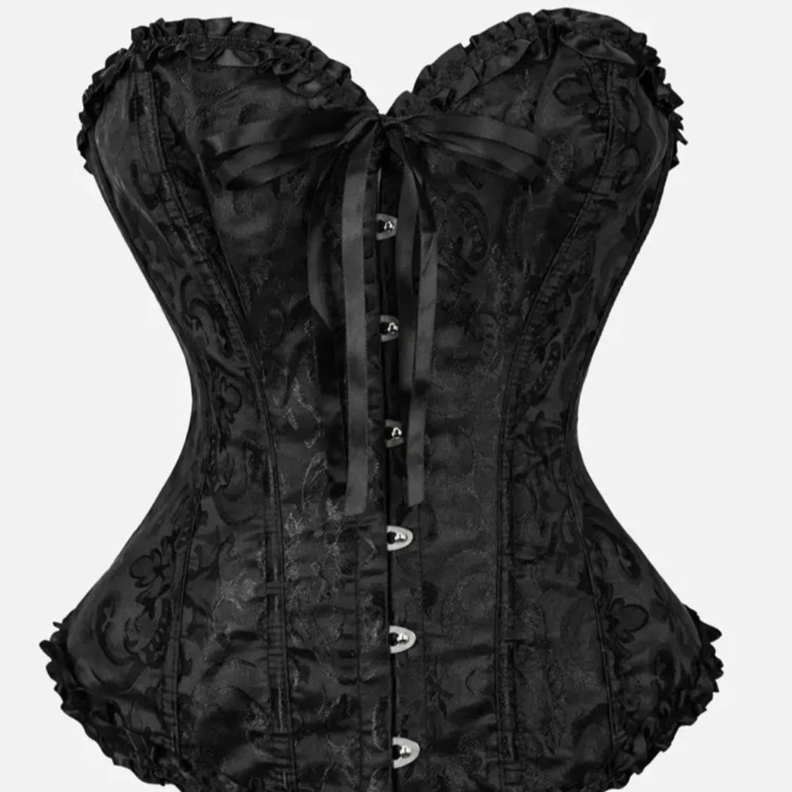Svart korsett med rosett och mönster