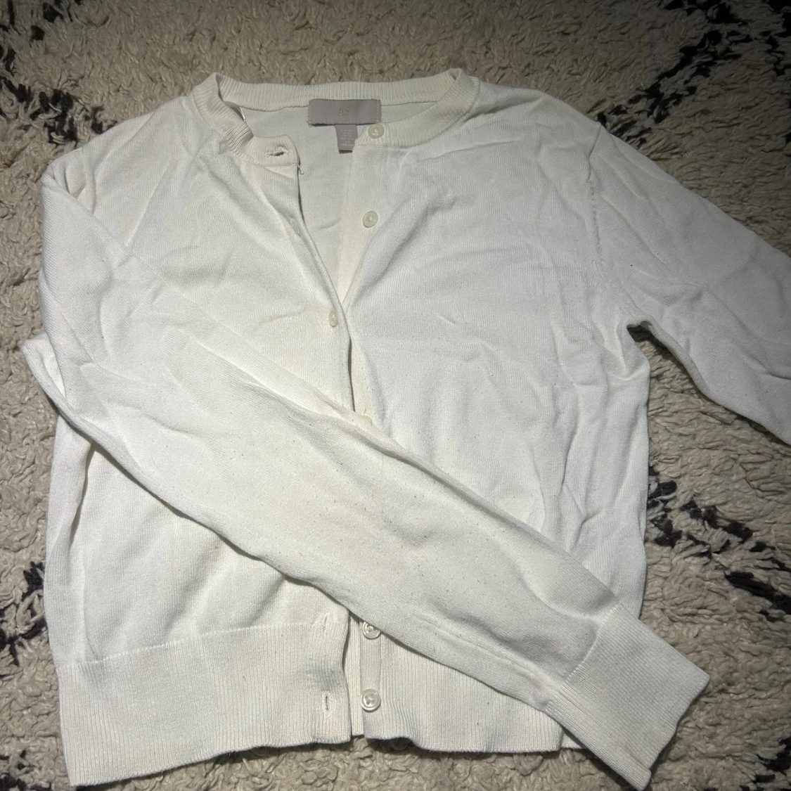 Vit kofta från H&M med knappar