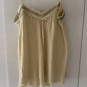 Linne från Stella McCartney x H&M - Suuuperr snyggt gult linne!!